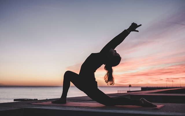 Person practicing yoga outdoors